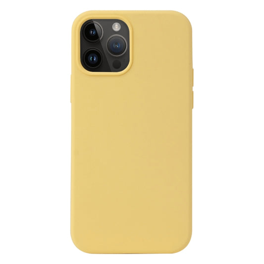 a yellow cell phone sitting on a table 