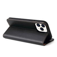 a black piece of luggage sitting on top of a table