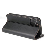a black piece of luggage sitting on top of a table