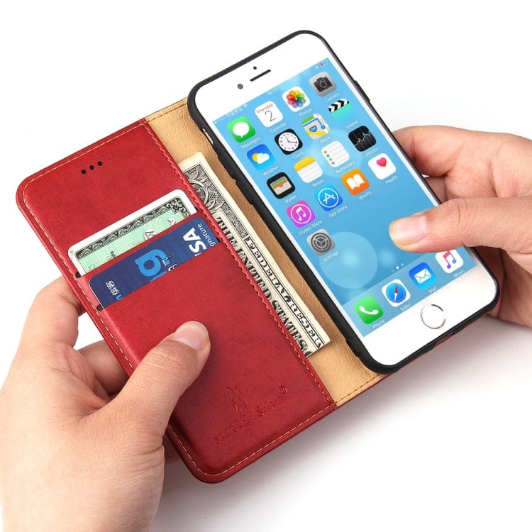 a person holding a cell phone in their hand 