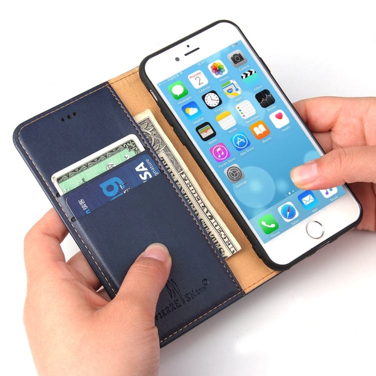 a person holding a cell phone in their hand 