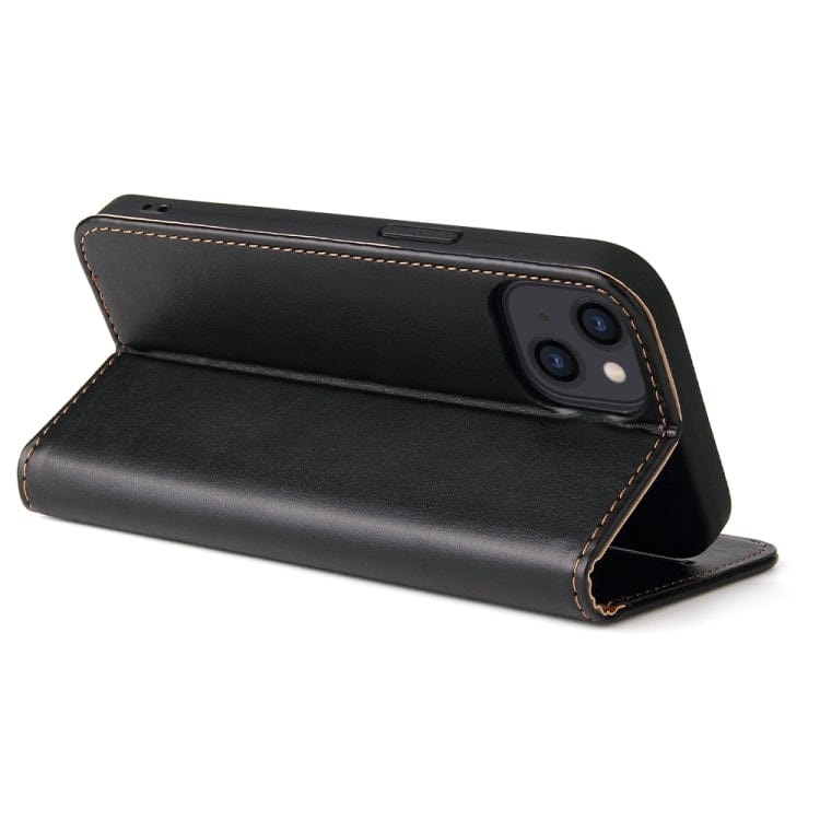 a black piece of luggage sitting on top of a table 