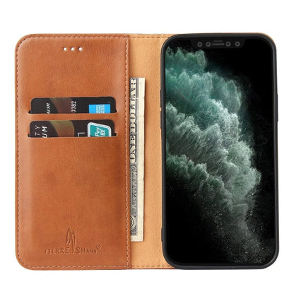 a cell phone that is sitting next to a stuffed animal 