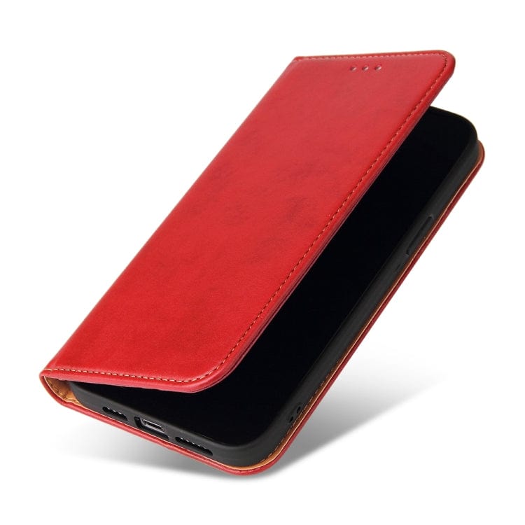 a red piece of luggage sitting on top of a table 