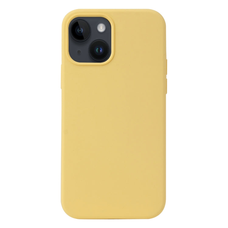 a yellow cell phone sitting on a table 