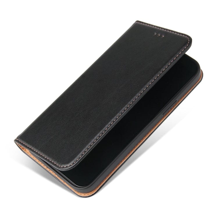 a black piece of luggage sitting on top of a table 