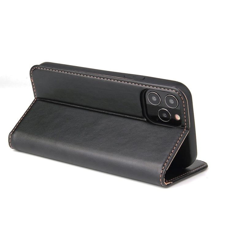 a black piece of luggage sitting on top of a table 