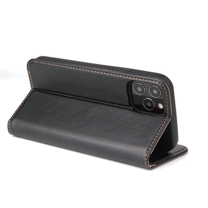 a black piece of luggage sitting on top of a table 