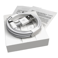 a cell phone sitting on top of a box 