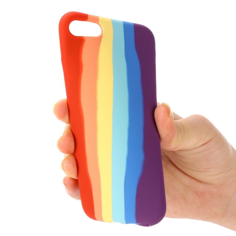 a person holding a colorful toothbrush in their hand 